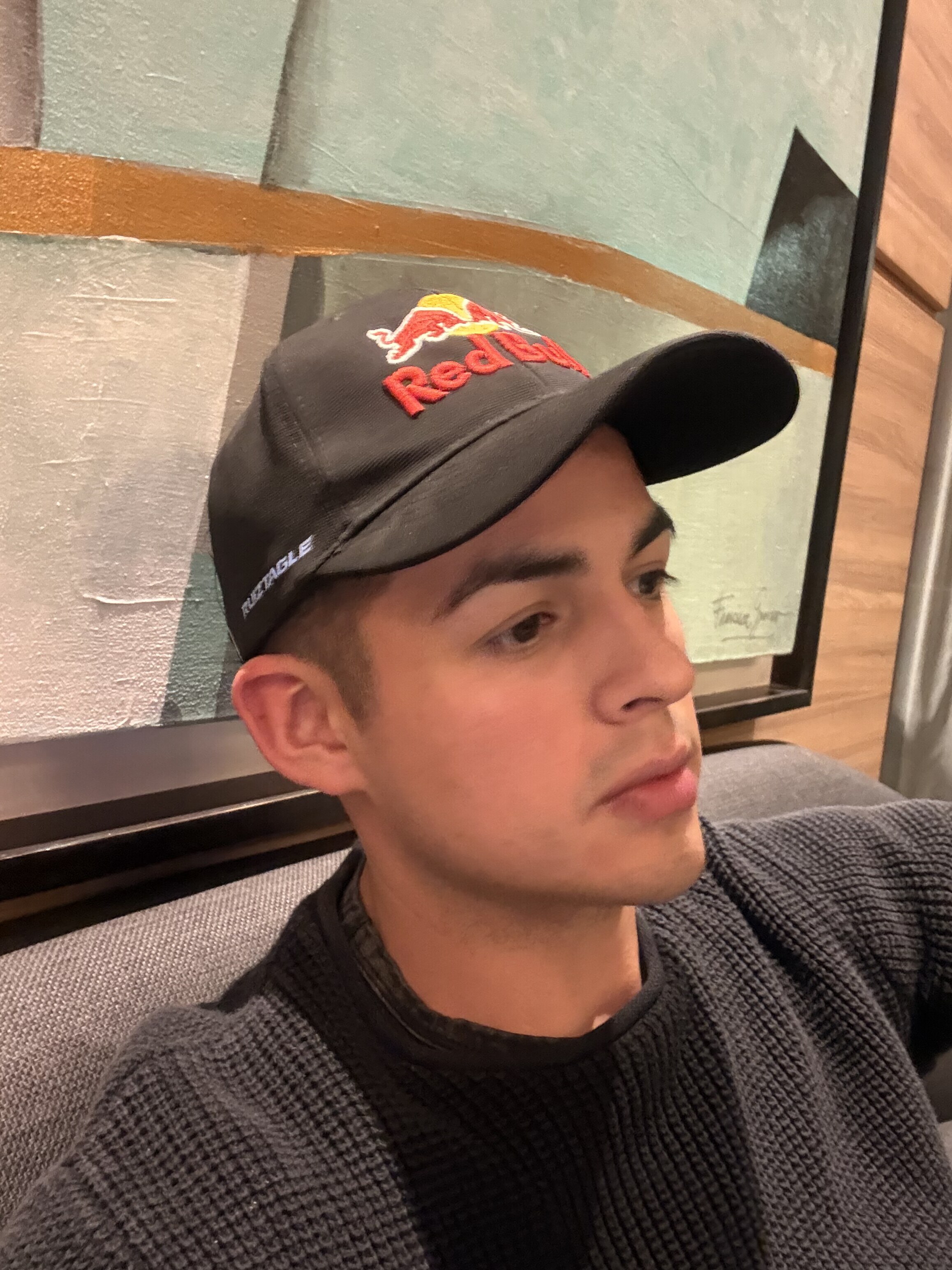 RUIZTAGLE portrait — Red Bull cap